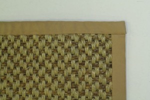 This tan natural fiber rug is finished at 77"x57" with a wide cotton binding and only available at CarpetWorkroom.com