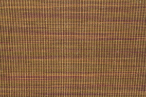 This brown and orange striped carpet remnant made of woven synthetic is 144"x66"