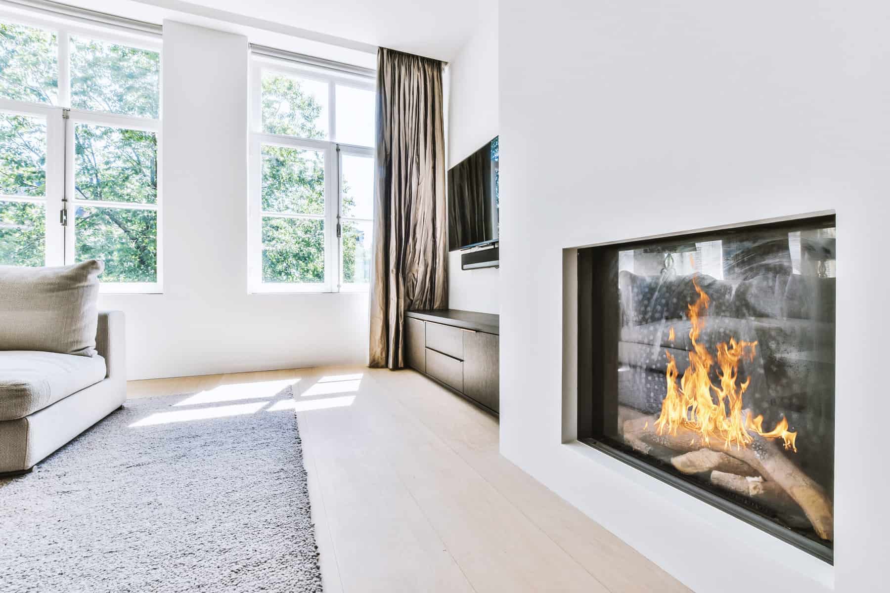 living room warmed up with fireplace and area rug