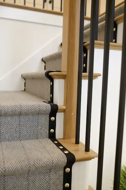 Grey herringbone style carpet fabricated and installed as a stair runner.
