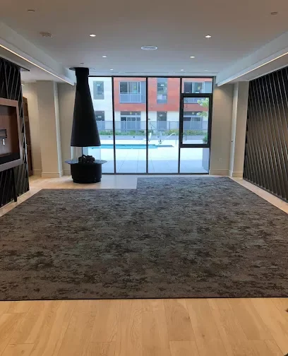 Commercial carpet installation with a dark color combined with the room.