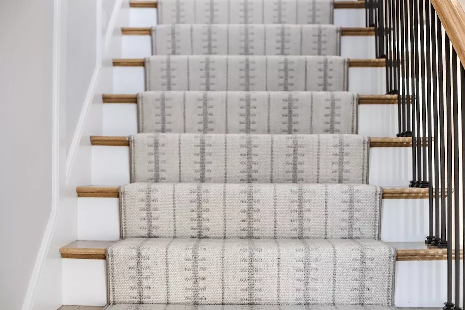 Ticking style light colors with a serging fabricated and installed as a stair runner.