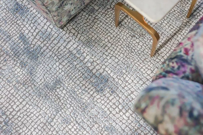 Carpet with an alligator skin effect white with navy blue effects by The Carpet Workroom.