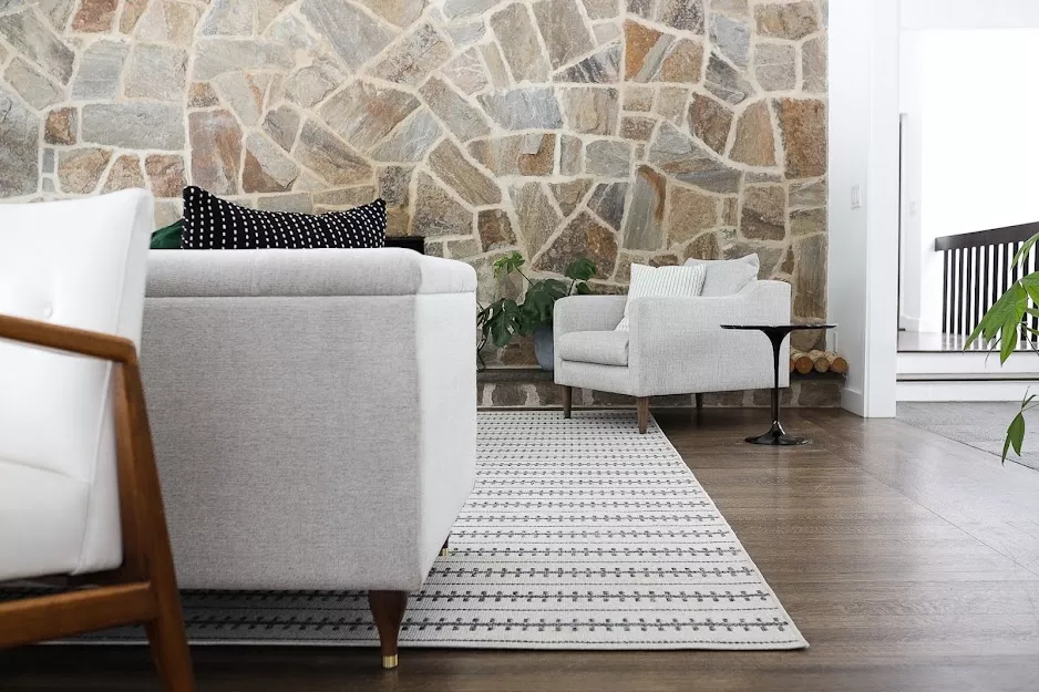 Living room decorated with light colors on a rug for the perfect view.