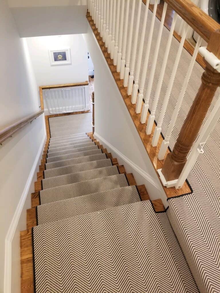 This is a Fibreworks Celio Monte Celio blue and white herringbone carpet installed as a stair runner
