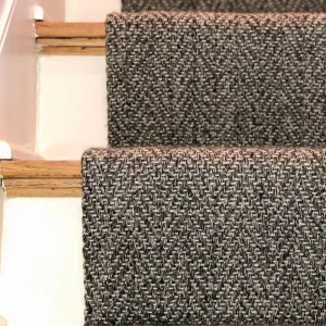 Self-edge cheveron style stair runner carpet finished and installed by The Carpet Workroom.