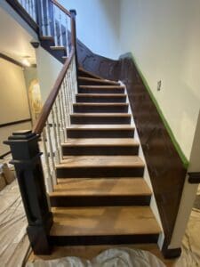 wood staircase before custom rainbow stair runner