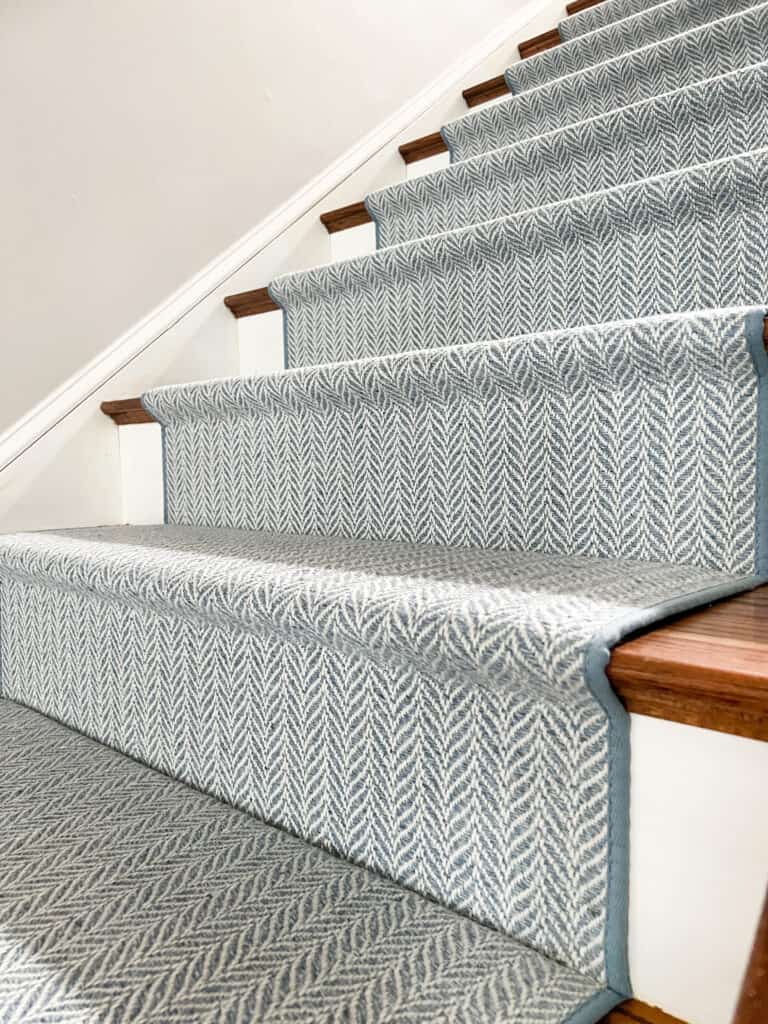 Blue wool stair runner installed Hollywood style 