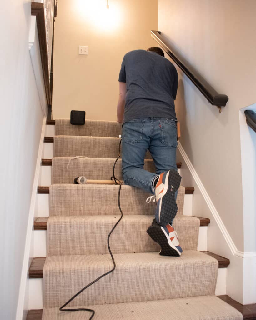 Stair runner being installed